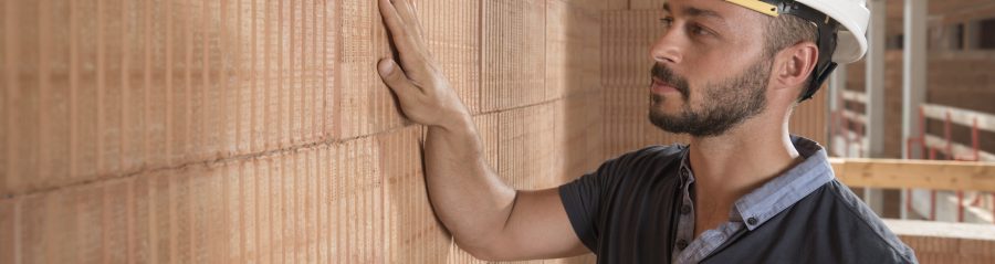 Building professional touching brick block wall