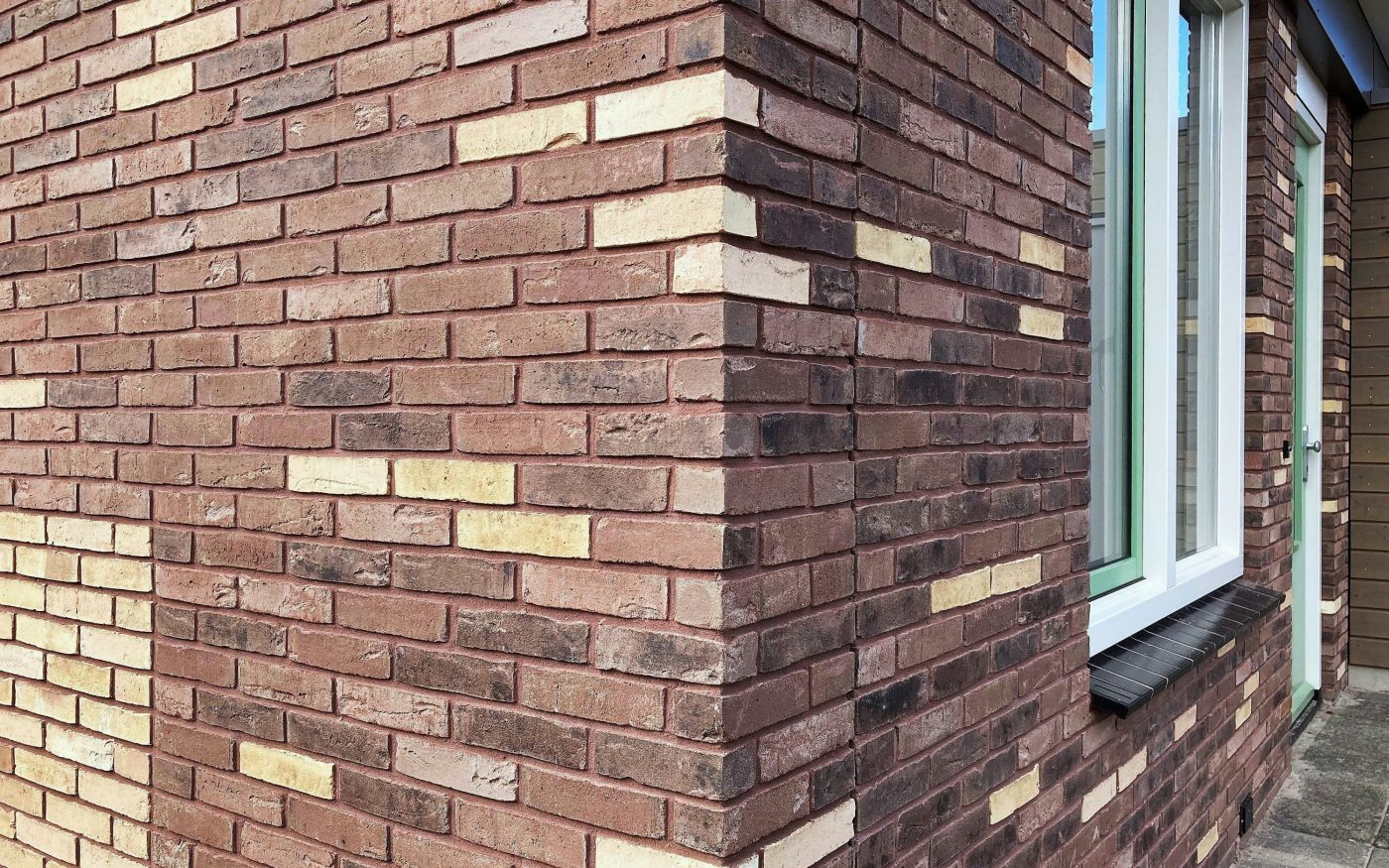 Maison individuelle à Saint-Amands en Belgique avec la brique Agora Lie-de-vin