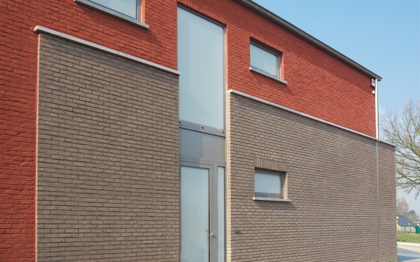 Maison individuelle avec la brique Pagus rouge foncé et Forum cromo