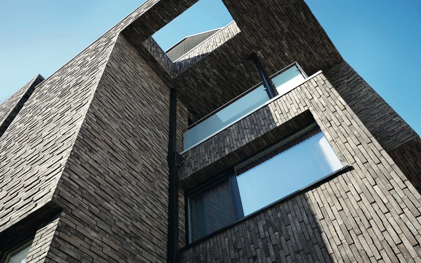 Logements collectifs à Gand avec la brique Pagus gris-noir