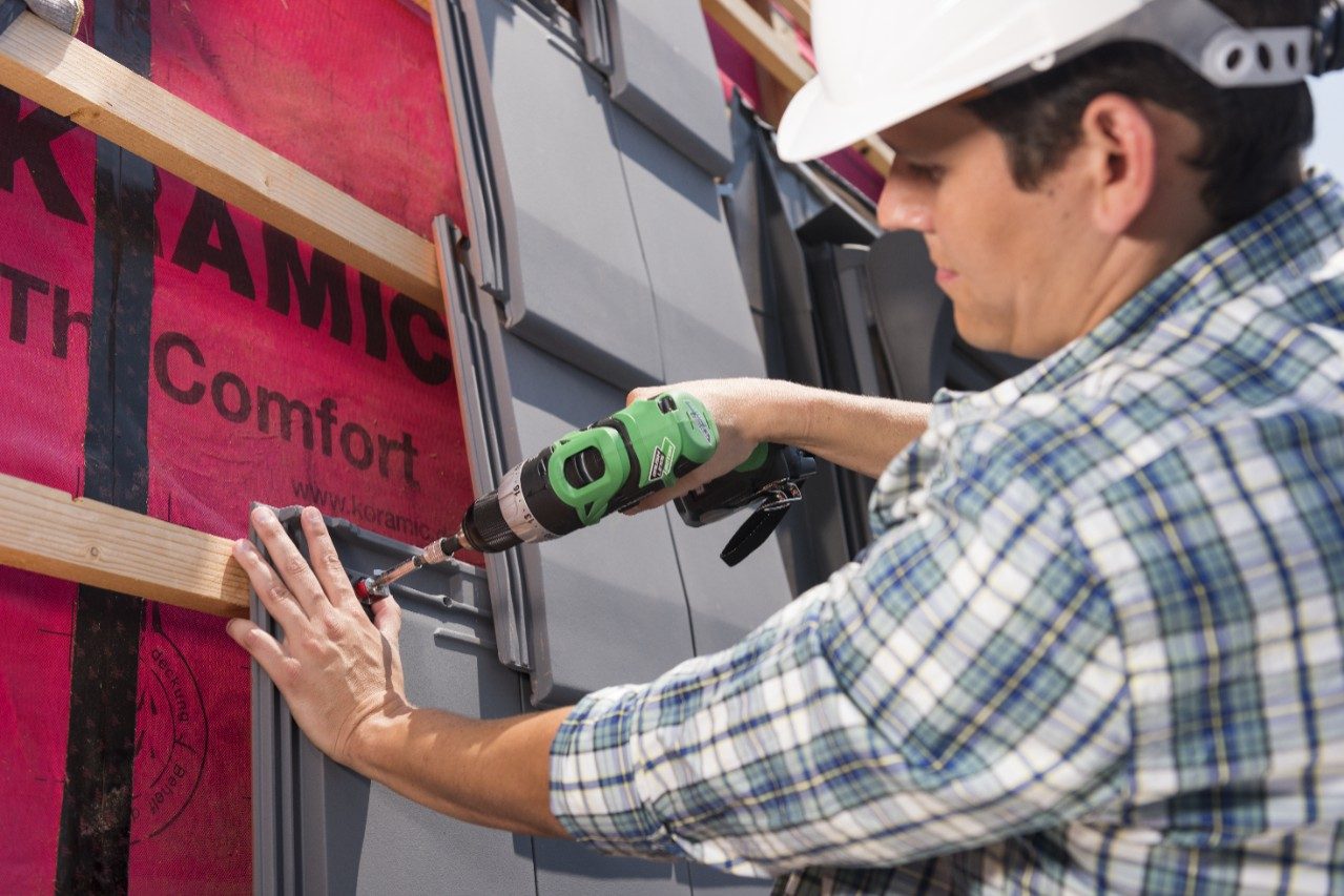 Roofers installing Actua roof tiles