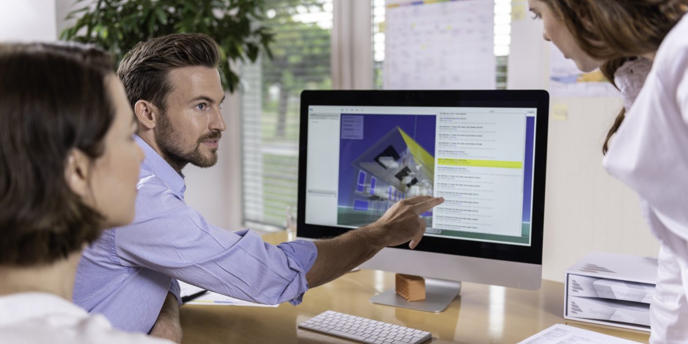 Project managers at office desk working with BIM