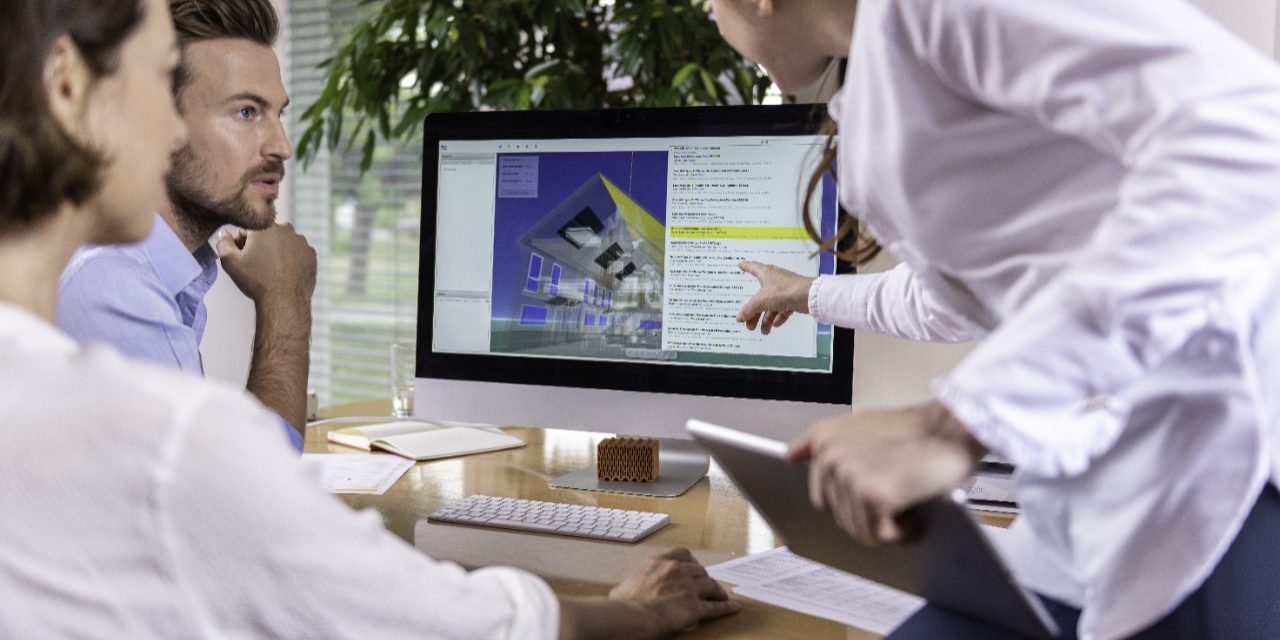 Project managers at office desk working with BIM