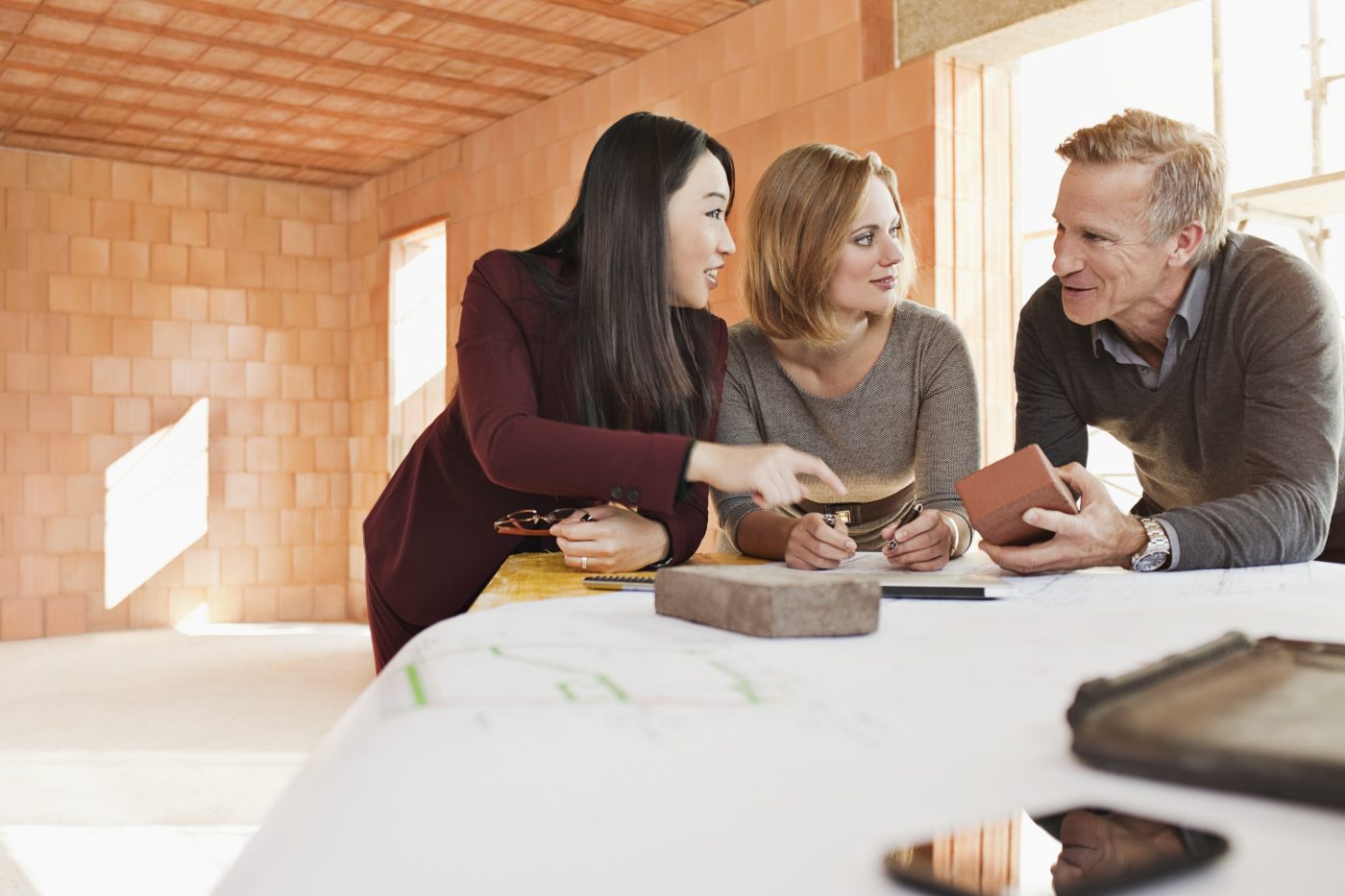 Group of people talking about building materials