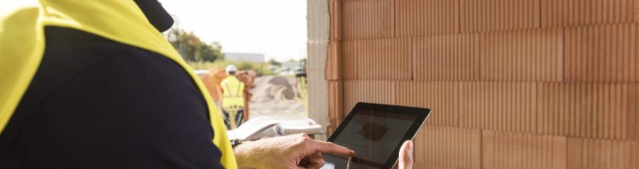 Construction worker with tablet computer