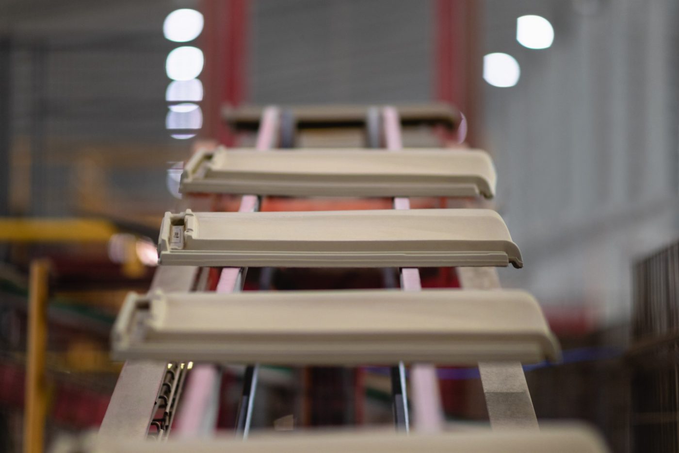 Raw roof tiles in their way to the tunnel dryer