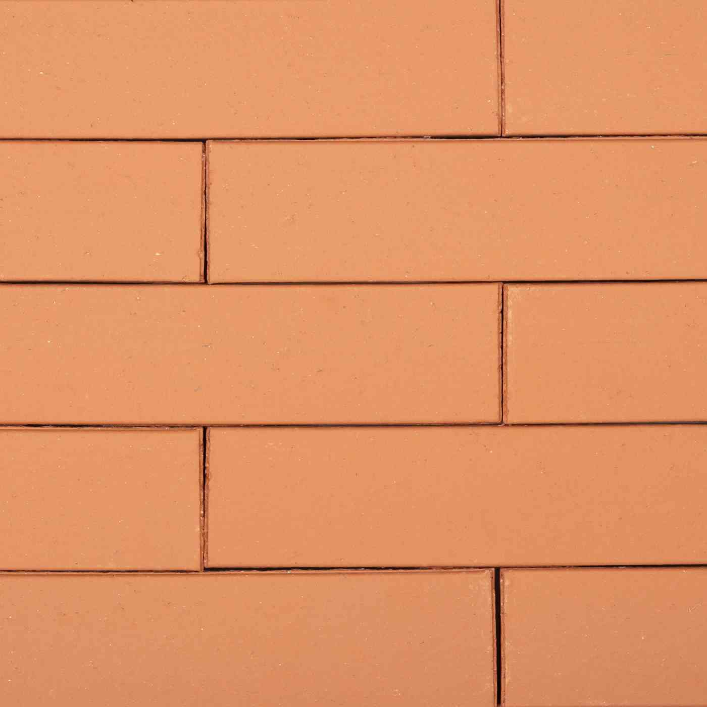 Briques de façade classiques maçonnées lisses couleur rouge-orangé
